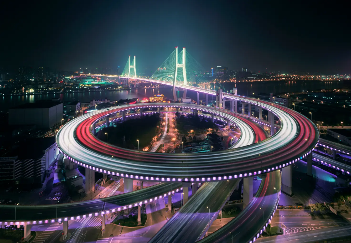 Highway with a bridge at night